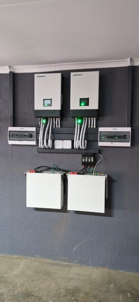 Dual inverter and battery backup power system on a dark feature wall, installed by Sky Projects