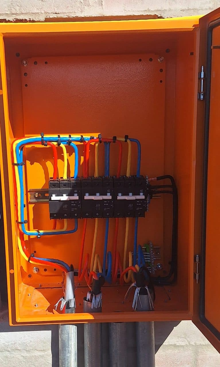 Neatly wired three-phase distribution panel by Sky Projects